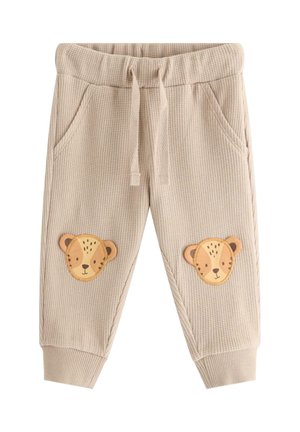 Beiget, teksturoidut taaperohousut, joissa on joustava vyötärönauha, kiristysnauha, sivutaskut, resorit lahkeensuissa ja eläinaiheiset kasvot polvissa.