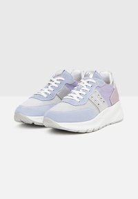 Light purple and gray sneakers feature suede and mesh materials, a thick white sole, and studded accents on the sides. White laces complete the design.