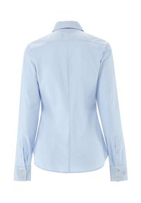 Light blue button-up shirt with long sleeves, a pointed collar, and a curved hem. Features buttoned cuffs and a smooth texture.