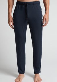 Navy loungebroeken van zacht materiaal, met een elastische tailleband en trekkoord, recht gesneden en met aangesloten boorden.
