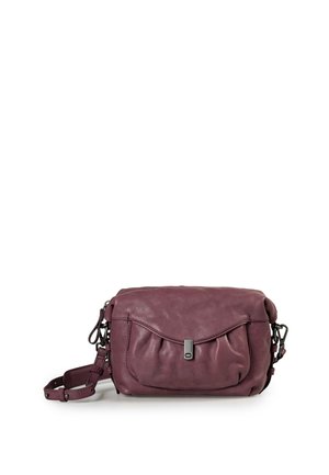 Small soft purple leather crossbody bag with front flap pocket, metal clasp, and adjustable strap on white background.