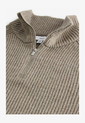 Beige ribbet sweater med høj krave og halv-zip lukning. Fremstillet af tekstureret materiale; har en sølvfarvet lynlås og label indeni.