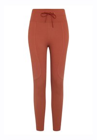 Rustfargede leggings laget av elastisk stoff, med høy livlinje, snor og sidepaneler for ekstra tekstur.
