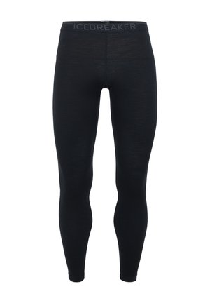 Leggings negros confeccionados en material suave con un ajuste ceñido. Cuentan con una cinturilla elástica etiquetada como "ICEBREAKER" para mayor comodidad y estabilidad.