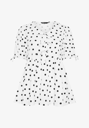 Witte blouse met korte mouwen, zwarte polkadots, drie strikjes aan de voorkant, opgeblazen mouwen en een uitlopende zoom.