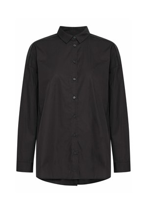 Chemise noire à manches longues en tissu rigide, avec un col pointu, une fermeture à boutons sur le devant et une coupe décontractée avec des épaules légèrement tombantes.