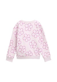 Ljusrosa sweatshirt med ett blommönster med rosa kanter. Rund halsringning och ribbade muddar. Mjukt tyg med en avslappnad passform.