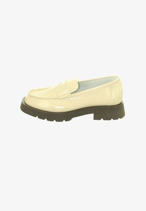 Cream-colored glossy loafer with a thick black lug sole and a penny strap across the upper side.