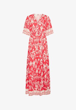 Czerwona maxi sukienka z białymi wzorami plemiennymi, dekoltem w serek i krótkimi falbankami na rękawach. Sięga do kostek z dopasowaną talią i ozdobnym wykończeniem.
