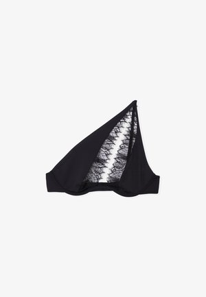 Sottile reggiseno a spalla unica di colore nero con un delicato pannello in pizzo che corre verticalmente attraverso la coppa, esposto su uno sfondo bianco.