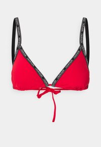 Top bikini triangolo rosso con spalline nere regolabili, caratterizzato dal logo 'Calvin Klein'. Chiusura con lacci al centro anteriore. Texture liscia.