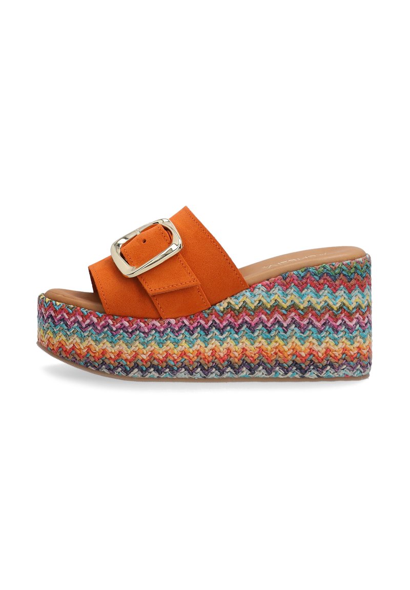 Orange suede wedge sandal with a large silver buckle and a colorful zigzag patterned woven platform sole. Open-toe design.