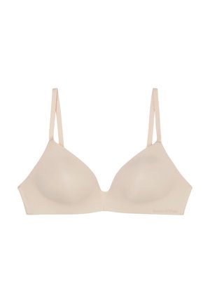 Beige draadloze bh van zachte stof, met plunge cups en verstelbare dunne bandjes. Glad textuur zonder versieringen.