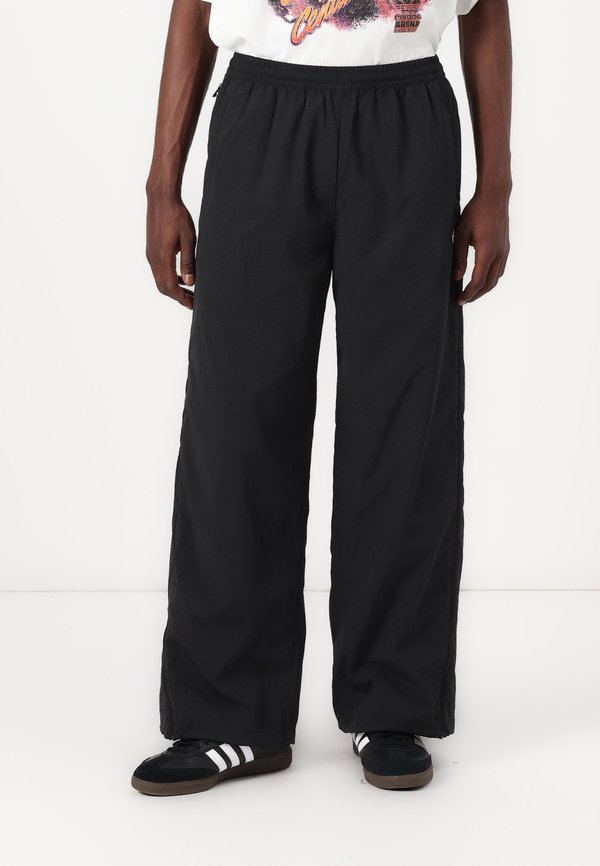ADILENIUM SEASONAL 3 OVERSIZED SUPERSTAR TRACK - Tracksuit bottoms