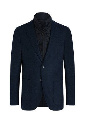 Blazer navy de exterior de lana texturizada, con cuello alto, forro interior acolchado, dos bolsillos frontales y cierre de botón.