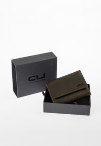 Dark green leather wallet with a smooth texture, folded design, and embossed logo, placed inside a black box with a matching logo.