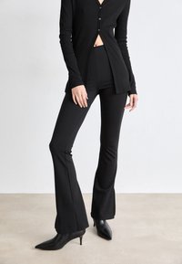 Calvin Klein Jeans - MILANO LOGO - Trousers - black Thumbnail Image 1