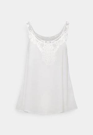 Blusa blanca sin mangas con detalles de encaje alrededor del escote redondeado y patrones florales en las tiras.