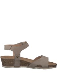 Tan leather wedge sandal with an adjustable ankle strap, textured footbed, and cork outsole. Features a cross-strap design for comfort.