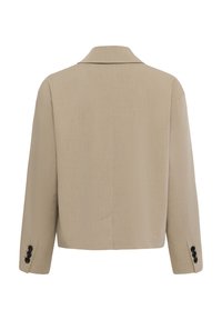 Blazer beige ajusté vu de dos avec manches longues et trois boutons noirs sur chaque poignet.
