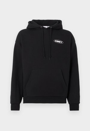 Crna pamučna majica s kapuljačom koja ima džep sprijeda, kapuljaču sa vezicama i izvezeni logo "OBEY" na prsima. Mekana tekstura, opušteni kroj.