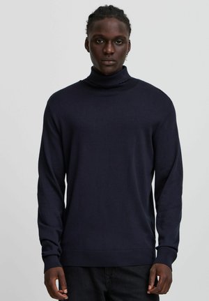 Mörkblå polotröja i stickad kvalitet med långa ärmar och en figurnära midja, med en slät yta och minimalistisk design.