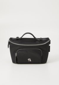 Black nylon bag with a top handle, silver zipper closure, front zipper pocket, and a small logo detail on the front. Smooth texture.