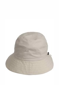Beige bucket hat gjord av lätt tyg, med en rund krone, bred skärm och justerbar dragsko för passform. Slät yta med subtil sömnad.