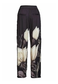 Black wide-leg pants with large cream and beige floral print and elastic waistband, shown from the back.