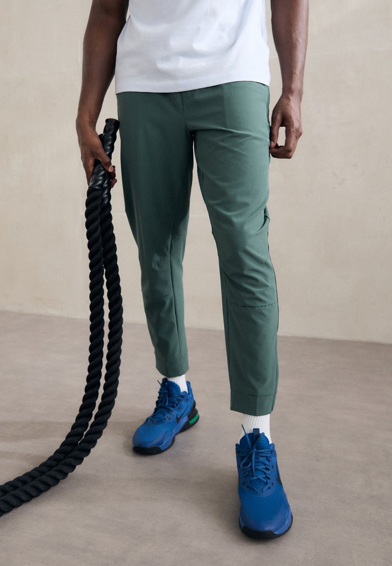 Nike Performance UNLIMITED PANT - Treningo apatinė dalis - vintage green/black