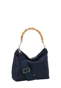 Navy fabric shoulder bag with a bamboo handle, adjustable strap, gold hardware, and a slouchy design. Features a textured exterior.