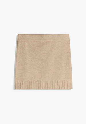 Beige knitted skirt with ribbed hem, soft texture, straight shape, and no visible fasteners. Simple, versatile design for layering.