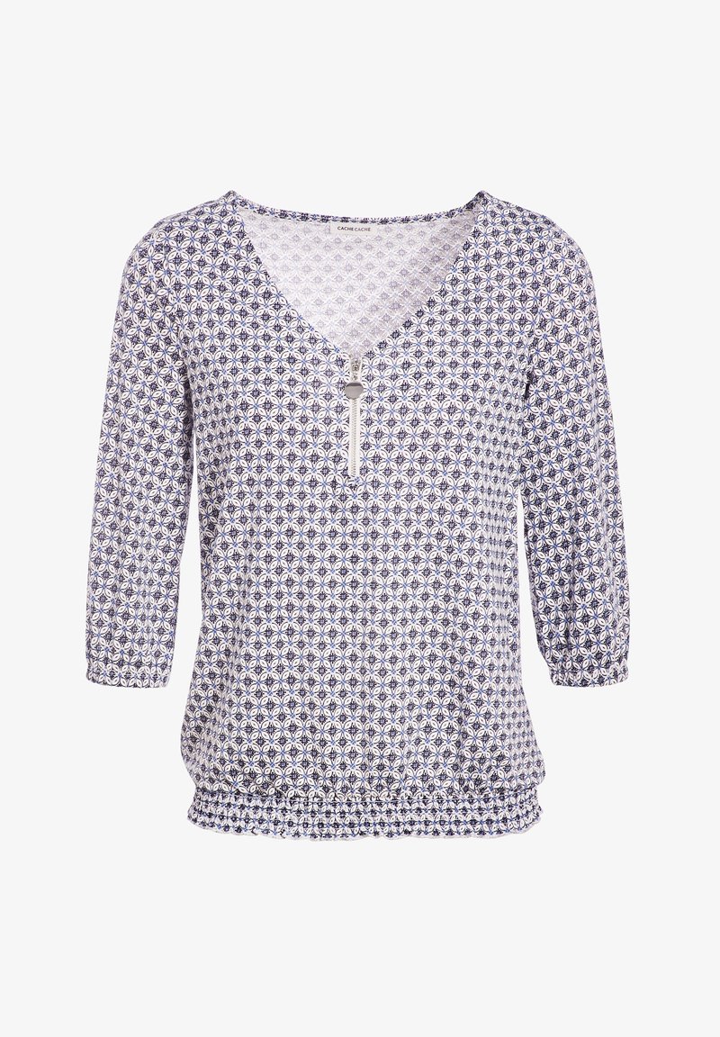 Blouse à motifs bleu et blanc avec col en V, manches ¾, taille cintrée et petit détail de fermeture éclair au niveau de l'encolure. Confectionnée en tissu léger.