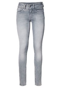 Jeans gris claro de corte ajustado con cinturilla de altura media, dos bolsillos frontales y una cremallera con cierre de botón. Material de denim suave con un ligero estiramiento.