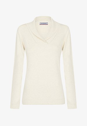 Kremowy sweter z długim rękawem, z prążkowanym kołnierzem szalowym i metką marki Felix Hardy wewnątrz kołnierza.