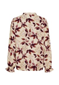 Blomstret bluse med lange ærmer og volangmanchetter. Fremstillet af let stof med en cremet baggrund og maroon- og grønne bladmønstre.