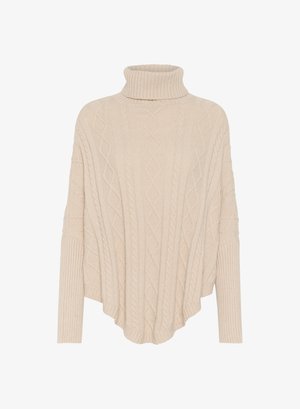 Beige cable-knit turtleneck poncho with ribbed detail on sleeves and hem, featuring a loose, flowing design and curved bottom edge.