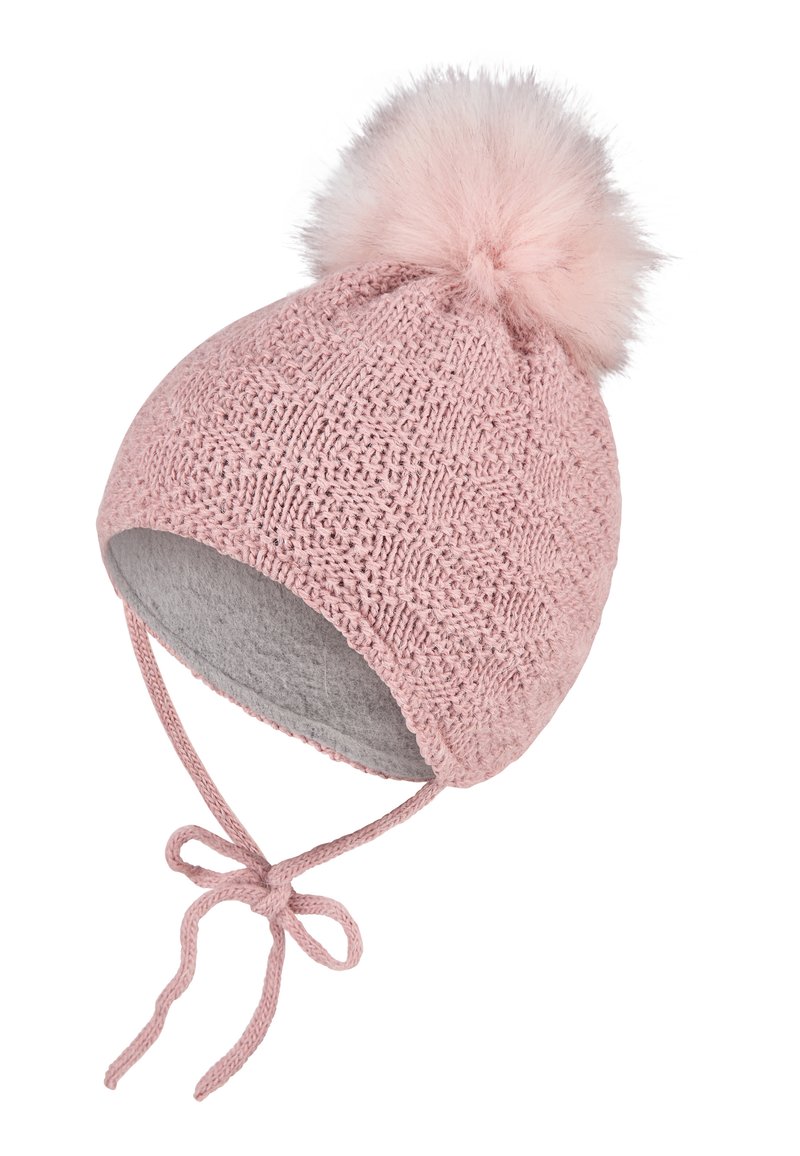 Pink knitted baby hat with ear flaps, tied strings, gray fleece lining, and a fluffy pom-pom on top, isolated on white background.