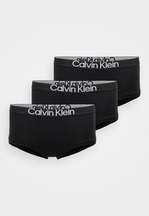Trois paires de boxers en coton noir avec une ceinture élastique grise arborant le logo "Calvin Klein" en blanc. Texture lisse, coupe ajustée.