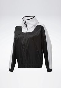 Veste coupe-vent légère noire et blanche avec fermeture éclair à l’avant, col haut, poignets et ourlet élastiques, présentée sur un fond uni.