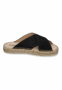 Black suede slip-on sandal with crossed straps, jute rope sole, and white rubber outsole. Minimalist design with exposed foot.