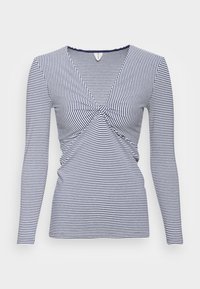 Marinblå och vitrandig långärmad topp med en knutdetalj fram och rundad halsringning. Tillverkad av ett mjukt, stretchigt material.