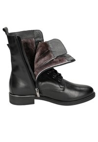 Stivaletti neri in pelle con zip laterale, dotati di un rivestimento in flanella pieghevole, suola piatta e design con lacci sul fronte.