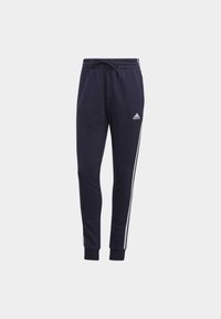 Navy cotton blend sweatpants with elastic waistband, drawstring, tapered legs, and white side stripes. Adidas logo on left leg.