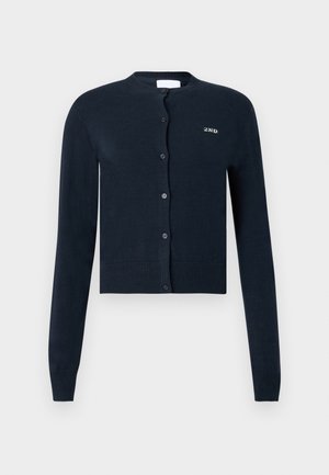 Navy blue cropped cardigan made of soft knit fabric, featuring a round neckline, long sleeves, button closure, and contrasting embroidered logo.