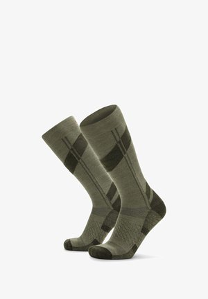 Calze verdi a motivo, realizzate in un tessuto strutturato, con una combinazione di strisce e disegni a rombo, dotate di rinforzi nella punta e nel tallone.