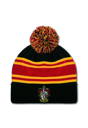 Knit beanie with black, red, and yellow horizontal stripes, featuring a large multicolored pom-pom and a Gryffindor crest on the front.