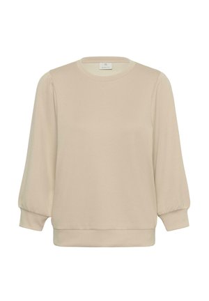 Blouse beige à manches longues avec manches bouffantes et poignets ajustés, encolure ronde et coupe décontractée, présentée sur un fond blanc.