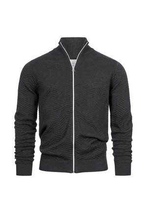 Cárdigan de cremallera en gris oscuro con textura de espiga, puños y cuello acanalados. Presenta una cremallera blanca en contraste.
