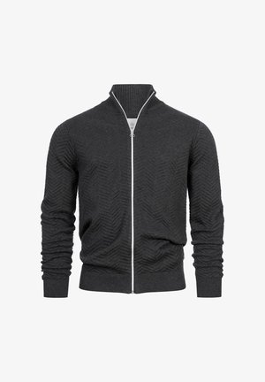 Cárdigan de cremallera en gris oscuro con textura de espiga, puños y cuello acanalados. Presenta una cremallera blanca en contraste.